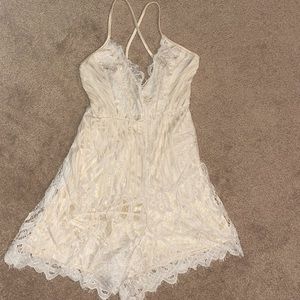 White (possibly bridal) romper with lace